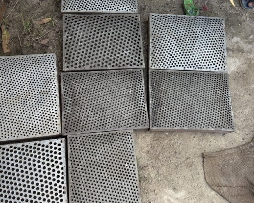 Perforated grading screens on the ground